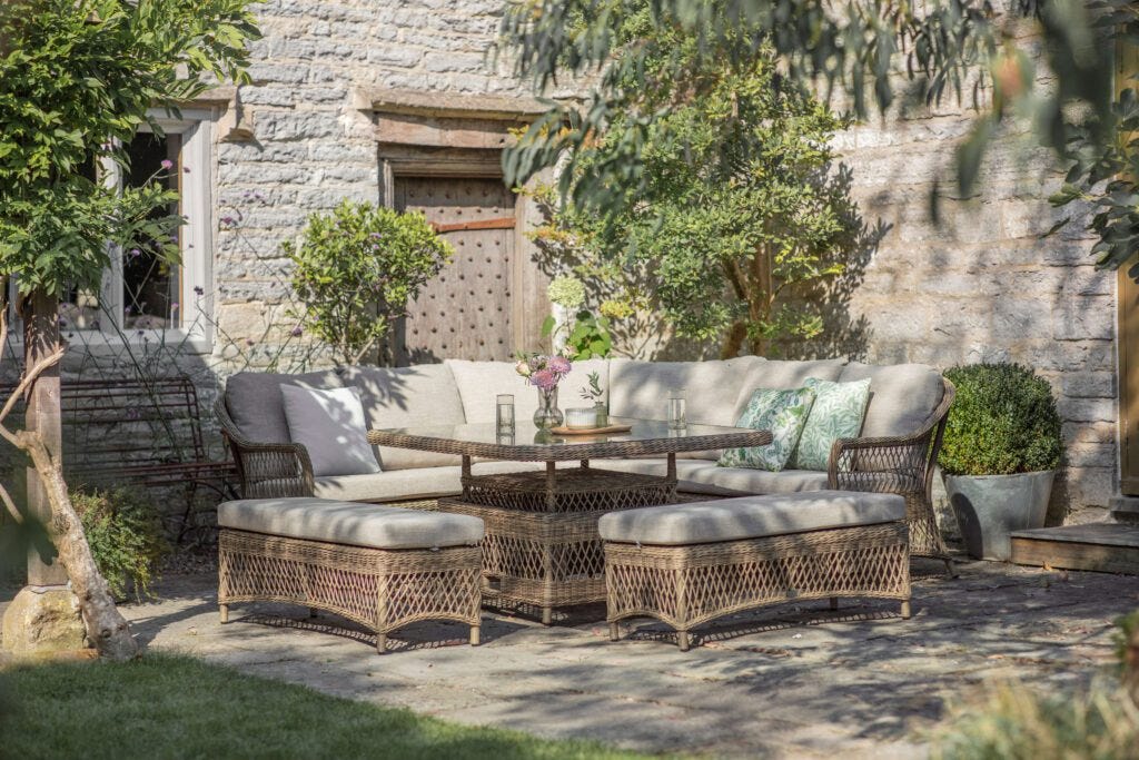 RHS Rosemoor garden furniture modular corner lounge set in a garden with greenery sat on a patio