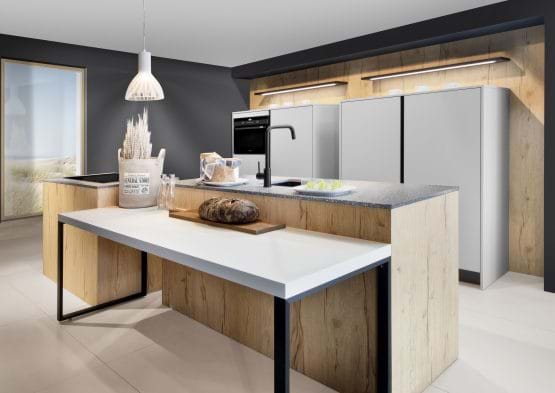 Rotpunkt Abbey Split Oak kitchen with oak wood cabinets with two tone worktop and island