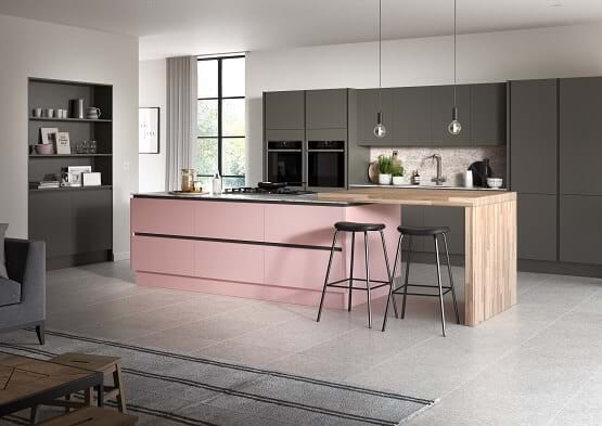 Sheraton kitchen in pink colour scheme with two tone cabinets in pink and grey and sleek handleless finish. 