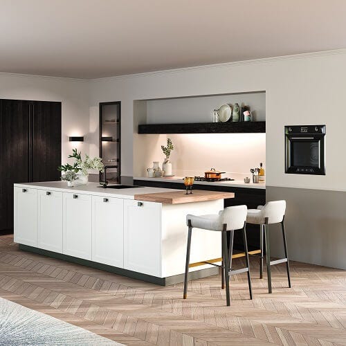 Rotpunkt kitchen with two tone cabinets in white and black colour scheme with wooden breakfast bar