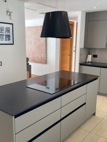 Rotpunkt dark grey kitchen with induction hob and kitchen island